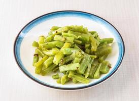 Cold tribute vegetables served in bowl isolated on white background side view of hong kong food photo