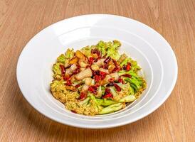 Sichuan Stir Fried Cauliflower served in bamboo steamer isolated on wooden table side view of hong kong food photo