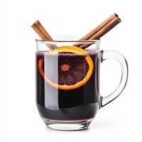 Mulled wine in a glass with cinnamon sticks and orange slices isolated on white background photo