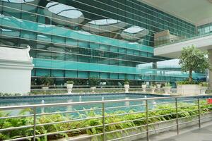 a large building with a pool in front of it at the new yogyakarta international airport photo