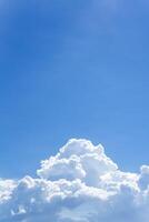 Vertical image of sky with white clouds on bottom picture photo