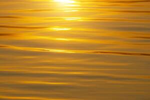 Close up water surface with sunlight. photo