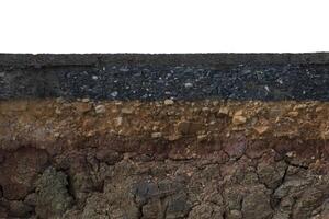 The layer of asphalt with soil and rock. Un-focus image. photo