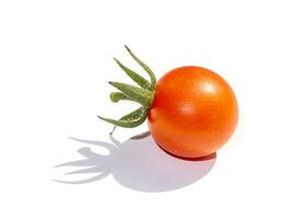 Close up tomato on white background with soft shadow. photo