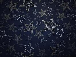 Golden and silver stars creating festive christmas atmosphere on dark blue background Gift boxes New Year preparation decor photo