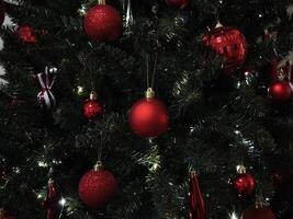 Christmas tree decorated with red and glittering ornaments in prague New Year preparation decor photo