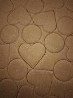 Preparing heart and circle shaped cookies from zucchini and carrot dough for valentine's day photo