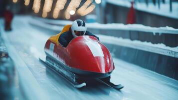 Skeleton racer is sliding down the ice track during training photo