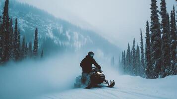 Snowmobiler riding through snowy forest trail in winter mountains photo