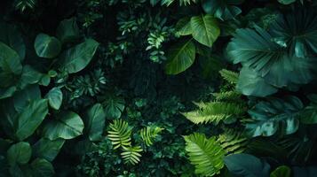 Tropical green leaves forming a natural textured background photo