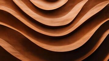 Brown wavy terracotta surface forming an abstract pattern photo