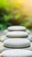 Dew covered stepping stones create tranquil path in serene garden photo