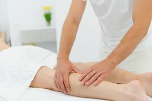 Woman getting relaxing feet massage with oils after long day photo