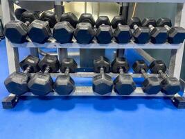 Unbalanced dumbbells for exercise photo