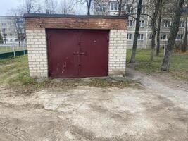 Brick garage in the yard photo
