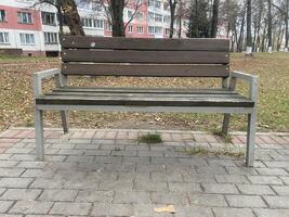 A bench in the park in the fall photo