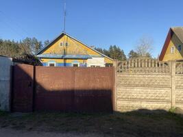 Houses in the countryside. Fence photo