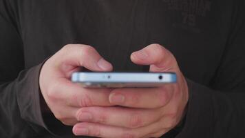A closeup image of hands using a smartphone, showcasing modern communication and technology in daily life photo