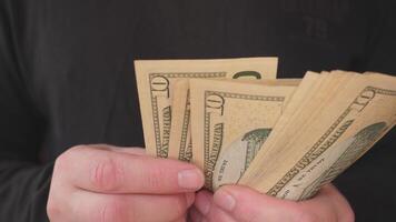 A close-up of hands counting cash, showcasing bills in a financial context, ideal for finance-related content. photo