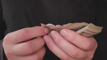 A closeup image of hands skillfully manipulating cash, highlighting the importance of money transactions photo