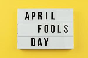 Lightbox Displaying April Fools Day Against Bright Yellow Background With Copy Space photo