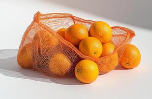 A mesh bag full of oranges photo