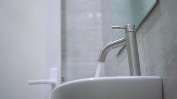 Water keep flowing from the faucet. tap water video