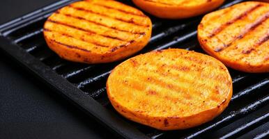Grilled Pumpkin Slices on Electric Grill, Veggie Barbecue Cooking, Vibrant Autumn Colors, Healthy Vegan Cuisine, Top View of Freshly Cooked Vegetables, Outdoor Seasonal Cooking Concept photo