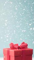 Red Gift Box With Ribbon in Snowy Background Suggesting Holiday Atmosphere for Winter Celebrations and Festive Designs photo
