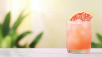 Refreshing Pink Grapefruit Cocktail With Ice And Citrus Slice On Marble Surface Against Blurred Green Background, Perfect For Summer Drinks, Freshness, And Tropical Vibes photo