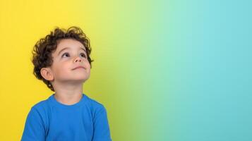 Child Gazing Upward Against Vibrant Blue Yellow Background in Studio for Conceptual Language and Cognitive Development Focused on Communication and Thought Process in Children with Curly Brown Hair photo