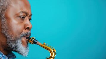 Close Up of Man Playing Saxophone Looking Away on Bright Blue Background for Music Concept and Instrumental Theme in Vibrant Color Scheme with Artistic Composition and Copy Space Idea photo