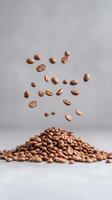 Dynamic Slow Motion Probe Lens View of Coffee Beans Bouncing and Falling on Pile Against Gray Background with Shallow Depth of Field and Soft Lighting photo