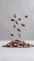 Coffee Beans in Super Slow Motion Falling on a Heap Captured with Probe Lens for Dynamic Motion and Texture in Kitchen or Coffee Shop Settings photo
