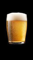 Refreshing Glass of Golden Beer with Frothy Head and Bubbles Representing a Classic Beverage for Celebrations and Parties on a Black Background Perfect for Autumn and Oktoberfest Themes photo