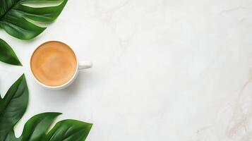 Minimalist Top View of Coffee Cup on Marble Surface with Green Leaves, Perfect for Modern Design Aesthetics and Branding in Cafes, Restaurants, or Social Media Marketing, Capturing Calm Vibe photo