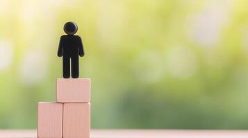 Inspirational Coaching Concept Depicting Business Success and Personal Growth with Figure on Blocks Against Green Background Achieving Goals in Leadership and Team Building Development photo