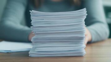 Stack Of Documents And Reports On Office Desk With Person In Background, Focus On Paperwork Height, Workplace Organization, Office Productivity, Business Task, Administrative Work photo