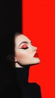 Striking Fashion Model with Bold Red Lipstick and Dramatic Makeup on Bold Red and Black Background for High Fashion Editorial Shoot photo