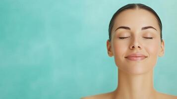 Serene Woman with Closed Eyes Relaxing Against a Turquoise Background at a Luxurious Spa, Emphasizing Tranquility and Self-Care in a Wellness Setting, Featuring Smooth Skin and Relaxed Expression photo