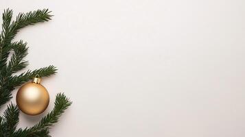 Minimalist Holiday Design Featuring Gold Ornament and Evergreen Branches on White Background for Festive Celebrations and Seasonal Decor Inspirations photo