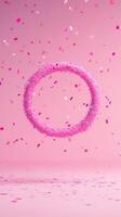 Pink Confetti Celebration Scene With Floating Ring On Soft Background Highlighting Festive And Joyful Elements In Vertical Format For Modern Holiday Or Event-Themed Stock Imagery photo