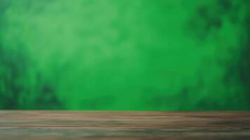 Wooden Desk Surface with Green Screen Background for Product Display or Virtual Design Concepts Featuring Empty Workspace Setup photo