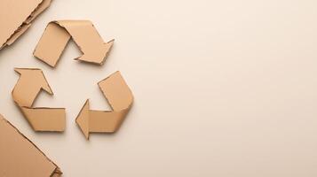 Recycling Symbol Made of Cardboard on Beige Background with Assorted Paper Materials for Environmental and Sustainability Concepts photo