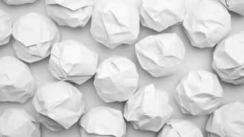 Minimalist Black and White Composition of Crumpled White Paper Balls Representing Creativity and Ideas Overhead View photo