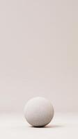 Minimalistic 3D Rendered Animation of Rotating White Sphere on Neutral Background with Subtle Texture and Soft Lighting for Modern Design photo