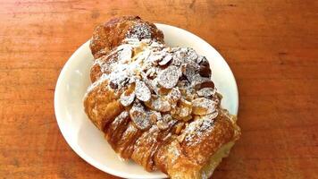 Croissant with powdered sugar and almonds in Mexico. video