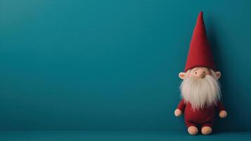 Christmas gnome with red hat and white beard on a teal background. Festive decoration. Horizontal composition with copy space for design and print photo