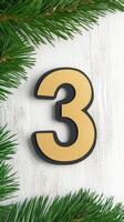 Festive Advent Calendar Day 3 with Golden Number on Rustic White Background Featuring Evergreen Pine Branches for Holiday Decor photo