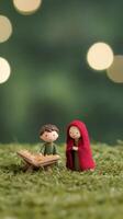 Charming Christmas Manger Scene with Handmade Figures in Cozy Red and Green Setting Featuring Baby Jesus Under a Soft Glow, Capturing the Holiday Spirit and Childlike Wonder. photo